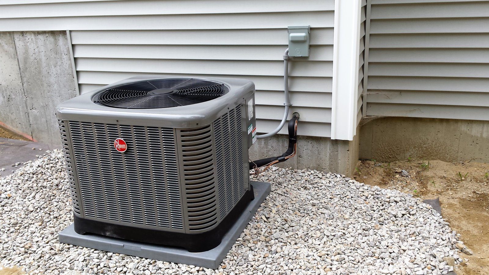 Outdoor air conditioning condenser unit on a gravel pad