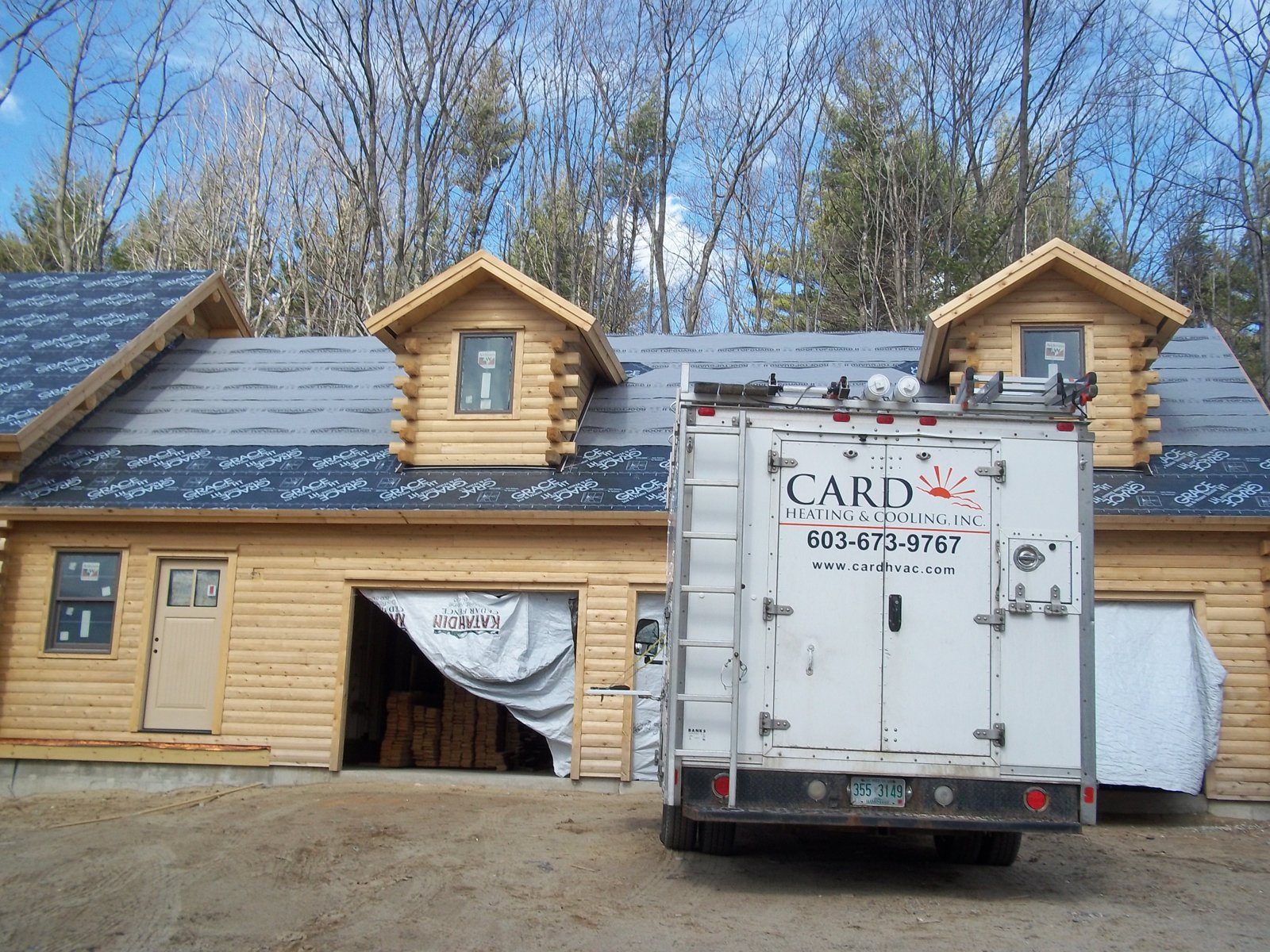 Card Heating & Cooling, Inc. truck on site at the log home build