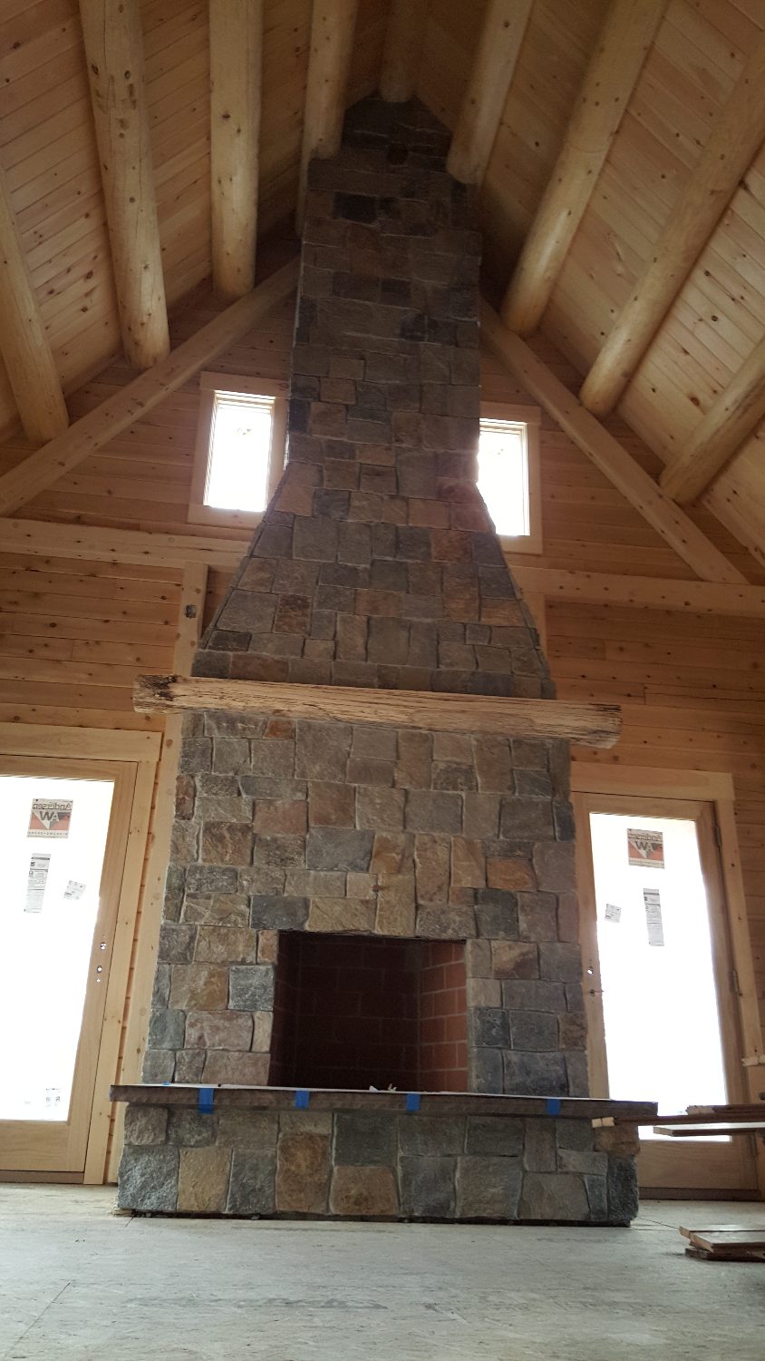 Beautiful stone fireplace in the new log home