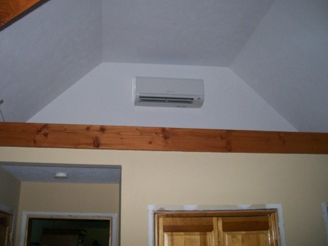 Mitsubishi ductless air handler installed in an attic space