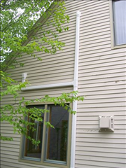 Paintable line hide running up the exterior siding to the outdoor unit