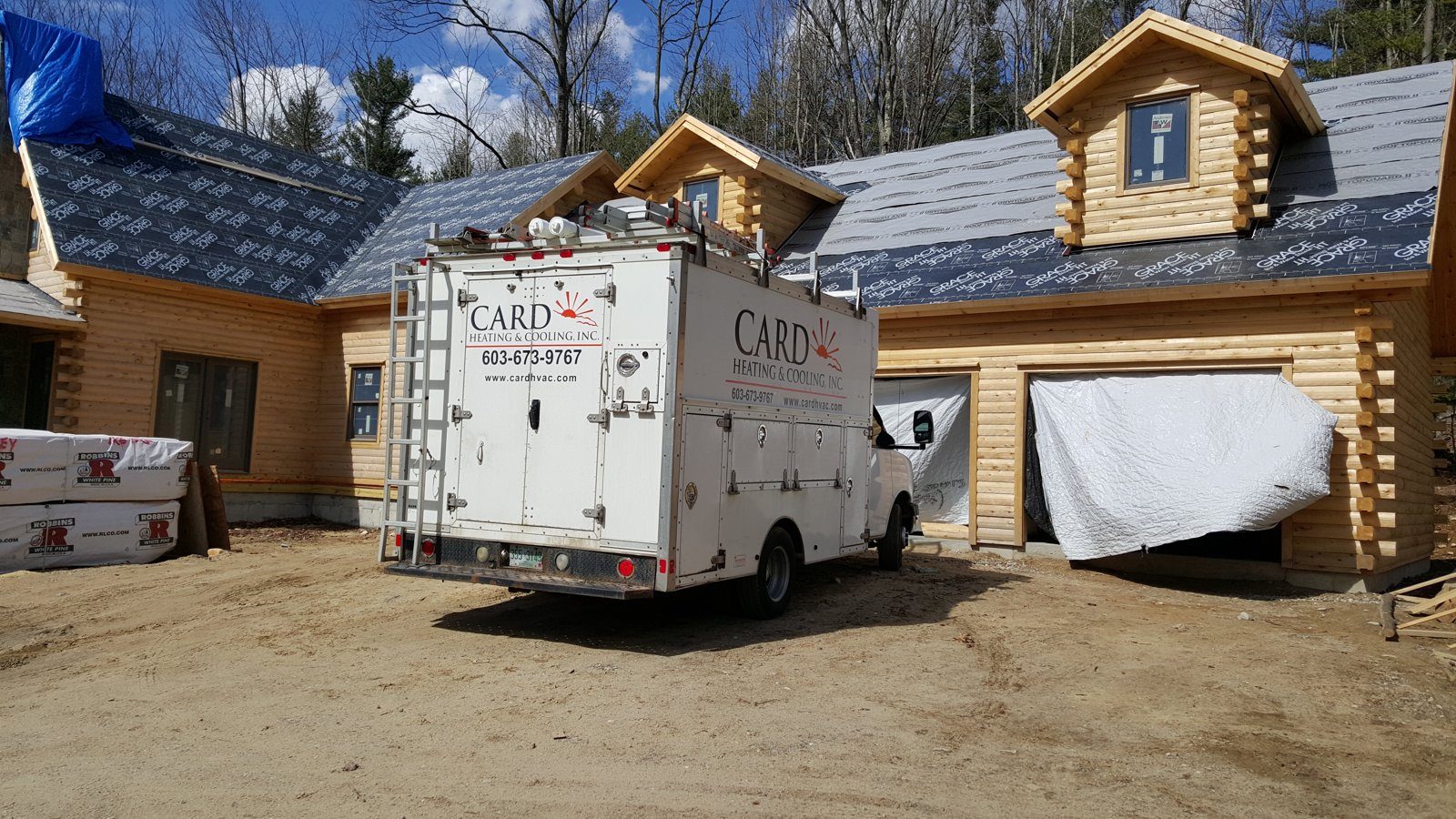 New log home construction in Wilton NH with Card Heating & Cooling truck