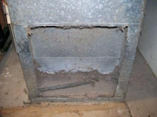 Neglected, dirty HVAC equipment coated in heavy dust build-up