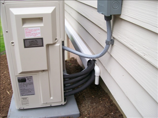 Fortress line hide enclosure on the exterior siding of a home