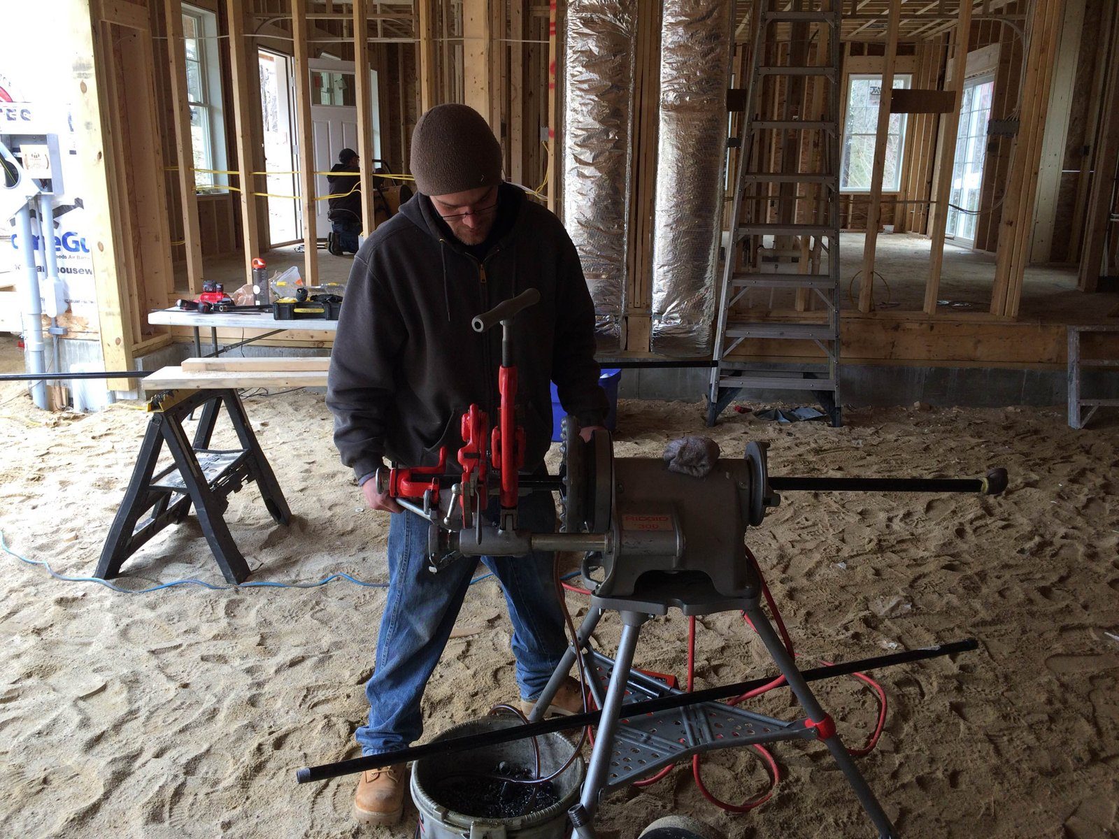 Steve Card running gas piping on a new construction project
